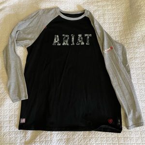 *ARIAT FR* baseball style sleeve t shirt w logo on black shirt w gray sleeves.